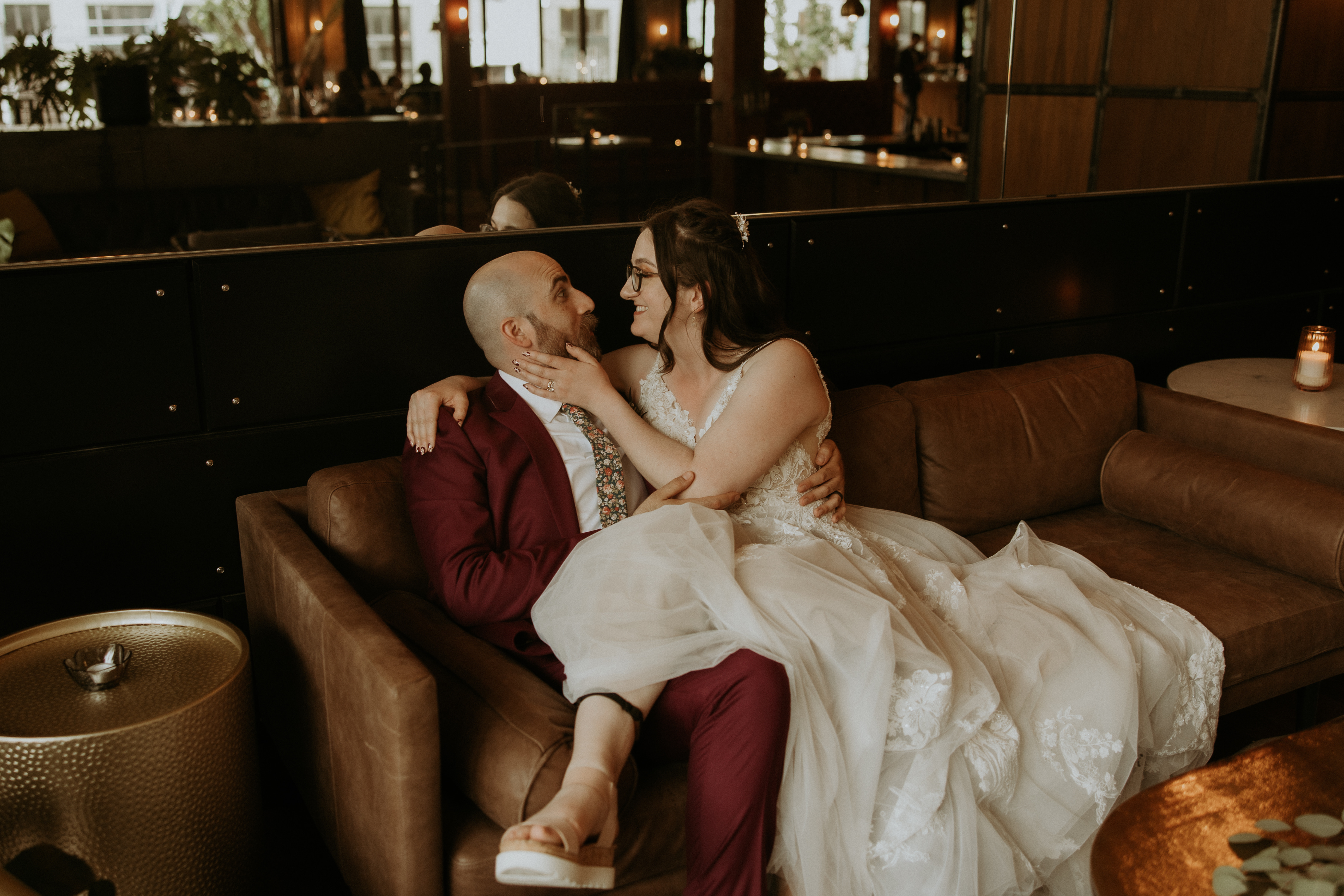 Picture of me and my husband on our wedding day. We’re sitting on a couch and you can see my fitbit on my ankle.